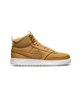 Championes de caña media Nike Court Vision Mid color marrón, con suela blanca y logo Nike en el lateral.