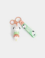 Llavero con dije de perrito apilado como helado, con strap de silicona verde con texto "Sweet Time" y mosquetón metálico.