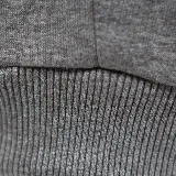 Pantalón de jogging gris melange, marca Topper, con cintura elástica y logo estampado en la pierna izquierda.