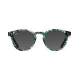 Lentes de sol Indie Pacific Botanic con montura redonda estampada en tonos verde, gris y blanco. Lentes grises polarizadas.