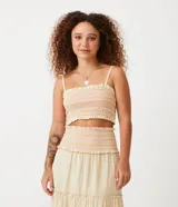 Blusa cropped de tirantes color crema con rayas horizontales rosas y naranjas, con elástico en el escote y en el bajo.