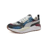 Championes Puma X-Ray 2 Square de estilo urbano y futurista, con capellada de malla gris, refuerzos de cuero sintético azul, blanco y negro, y detalles en rojo.