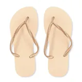 Chancletas Havaianas Slim color beige con tiras finas doradas.