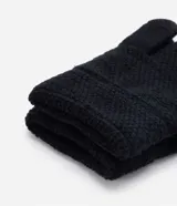 Guantes grises de punto con textura y tecnología touch screen.