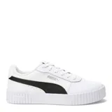 Championes Puma modelo Carina 2.0 para mujer, color blanco con franja lateral (Formstrip) negra. Presentan una plataforma gruesa con textura acanalada en la puntera y el talón, y cordones blancos.