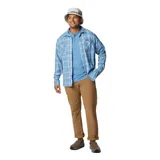 Pantalón de trekking color marrón claro, con cintura ajustable, rodillas articuladas, bolsillos laterales, bolsillo de seguridad con cremallera, refuerzo en la entrepierna, trabilla para cinturón multifuncional y bolsillos traseros.