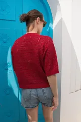 Saco tejido calado color celeste con mangas al codo y botones de coco.