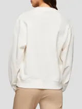 Buzo blanco de algodón con cuello redondo, puños y bajo de punto canalé. Logo de Tommy Hilfiger bordado en el pecho y en la manga.