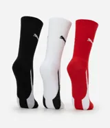 Pack de tres pares de medias Puma de caña media, en colores negro, blanco y rojo, con logo de la marca en el tobillo y detalle de rayas en el talón.