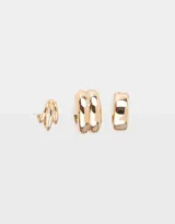 Set de tres aros earcuff dorados de metal en diferentes formatos.