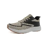 Zapatillas deportivas acordonadas color beige con detalles en negro y suela blanca.