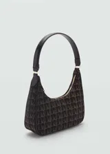 Bolso tipo baguette con estampado de monograma en tonos marrón y negro. Tiene asa corta de hombro, cierre de cremallera y forro interior con bolsillo.