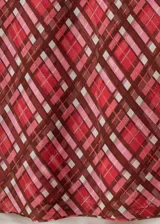 Falda midi de poliéster con forro interior, cintura elástica y estampado de cuadros en tonos rojo, marrón y beige.