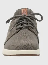 Zapatillas grises Hush Puppies modelo Spinal Knit con capellada de cuero y tejido de punto, cordones y suela blanca.