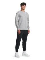Pantalón de jogging gris de corte ajustado, con cintura elástica ajustable con cordón, bolsillos laterales con cierre y logo de Nike bordado en negro en la pierna izquierda.