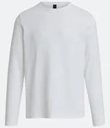 Remera de algodón blanca, corte slim, cuello redondo y manga larga.