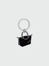 Llavero Longchamp con dije de bolso Le Pliage Xtra, color negro y detalles plateados.