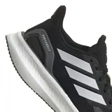 Zapatillas para correr con diseño negro y detalles en plateado, con tecnología de amortiguación.