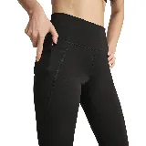 Calza deportiva Puma Essential Tight HW 7/8, color negro, con cintura alta, largo 7/8 y logo estampado en la pierna izquierda.