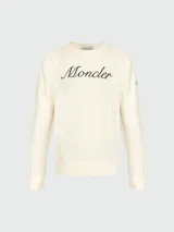 Sudadera color crema de algodón con cuello redondo y logo Moncler bordado en el pecho. Corte clásico con puños y bajo acanalados.